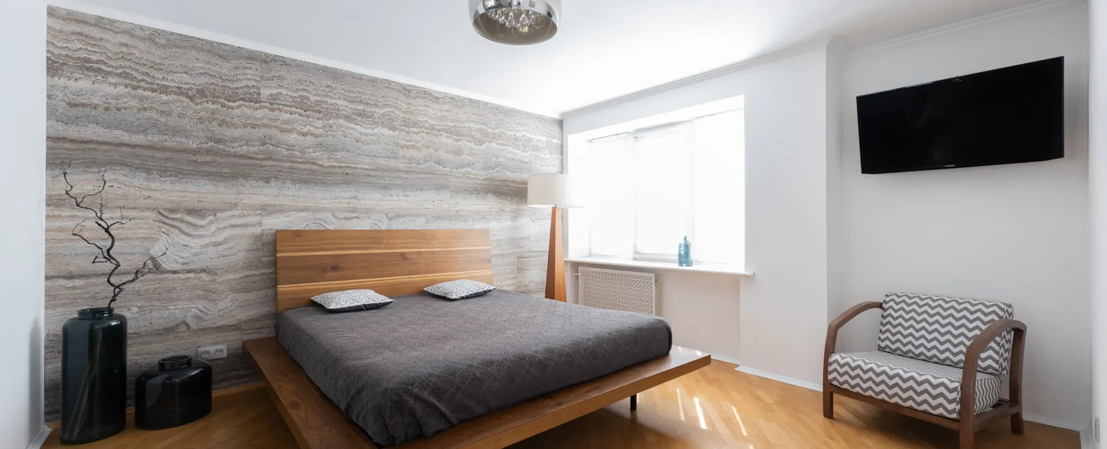 Bright tidy bedroom with natural light